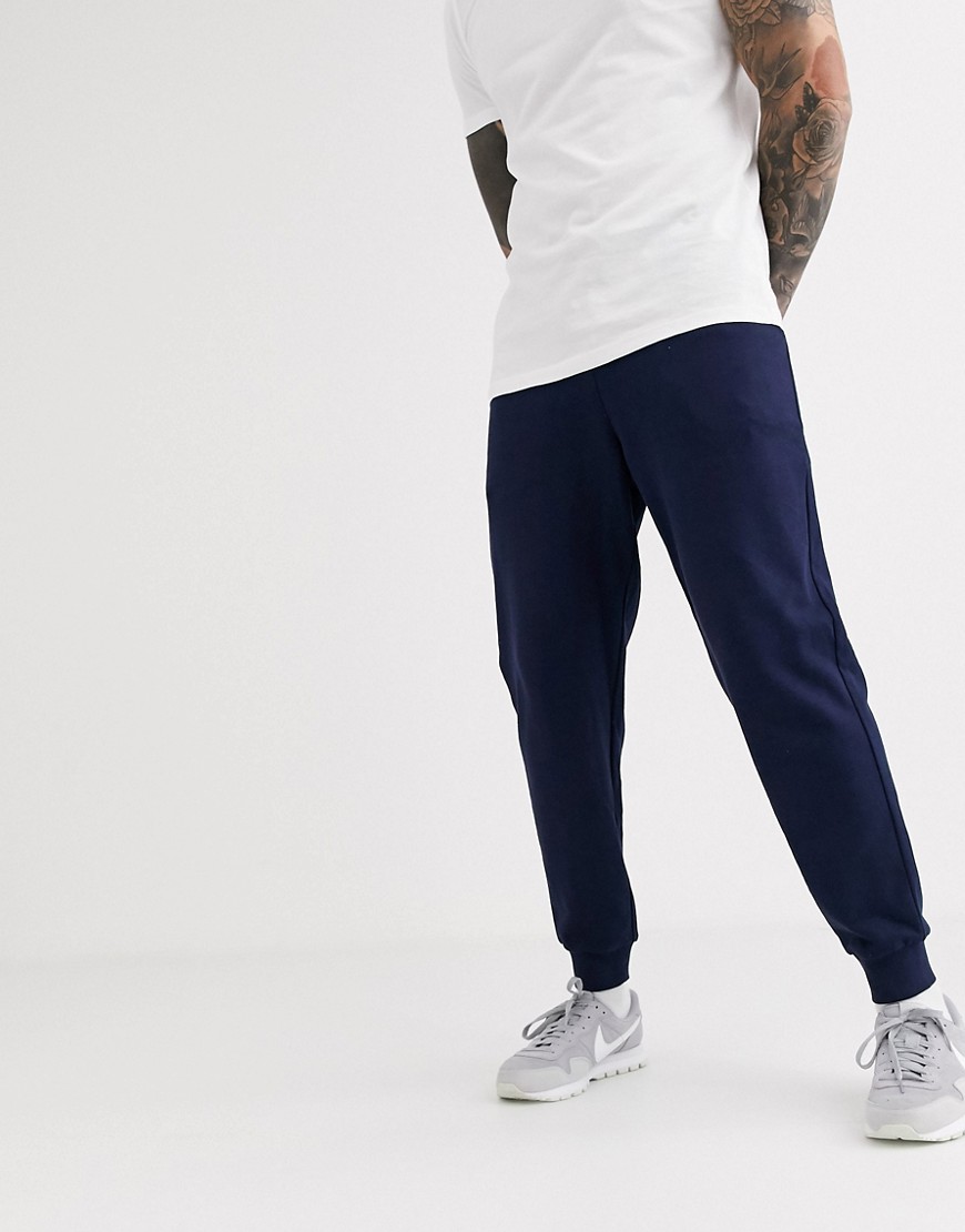 ASOS DESIGN organic tapered joggers in navy
