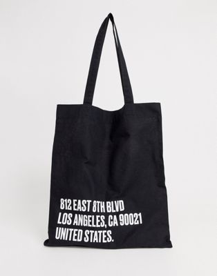 ASOS DESIGN organic tote bag in black white text print | ASOS