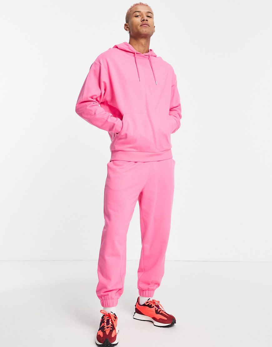 ASOS DESIGN organic tracksuit with oversized hoodie and oversized sweatpants in pink
