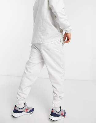 white hoodie and sweatpants