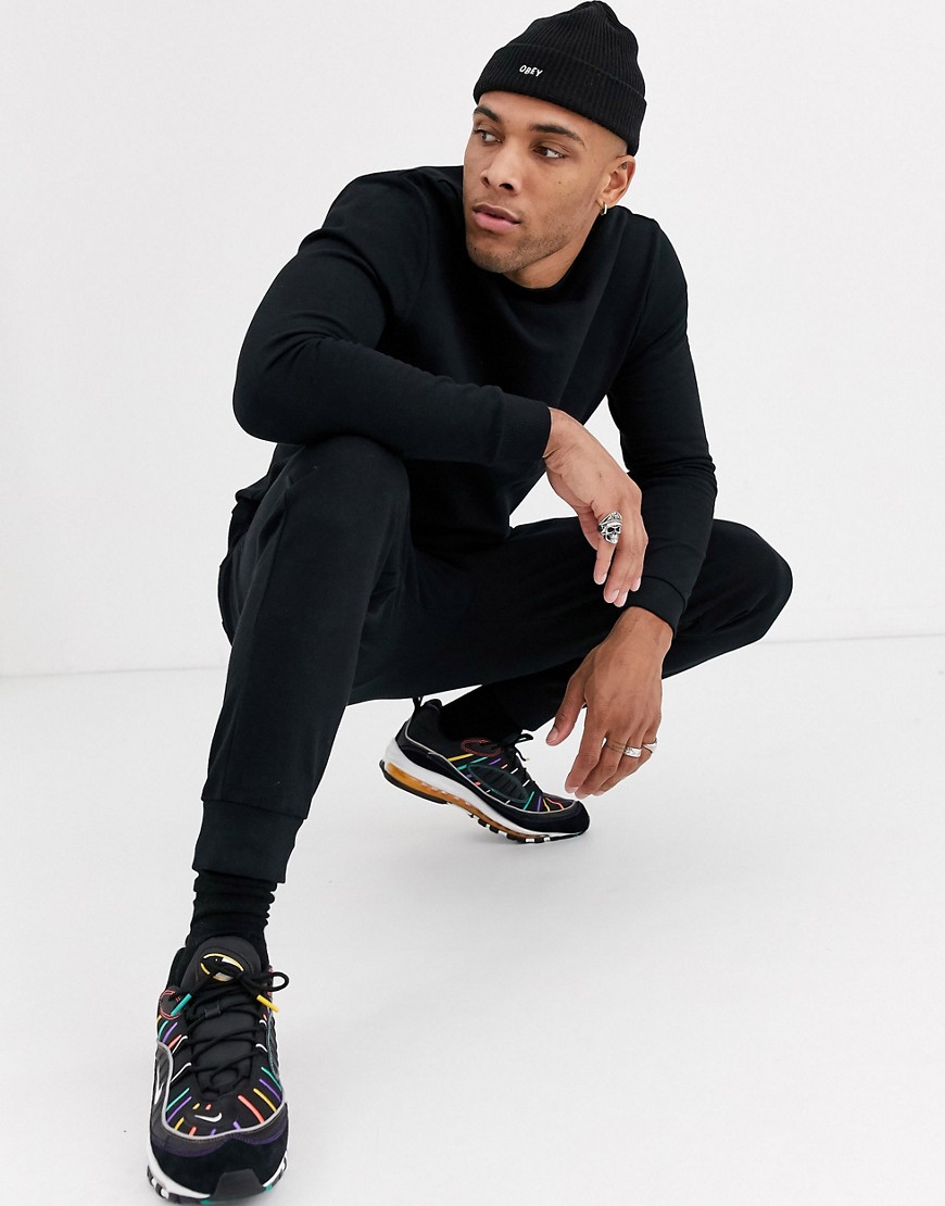 ASOS DESIGN organic tracksuit with tapered joggers in black