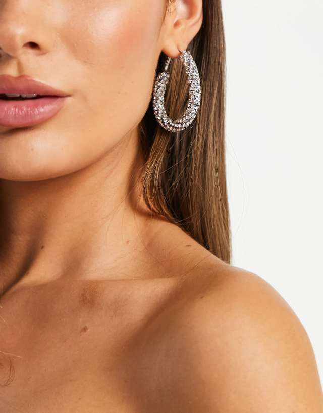 ASOS DESIGN oval hoop earrings in twist crystal drench