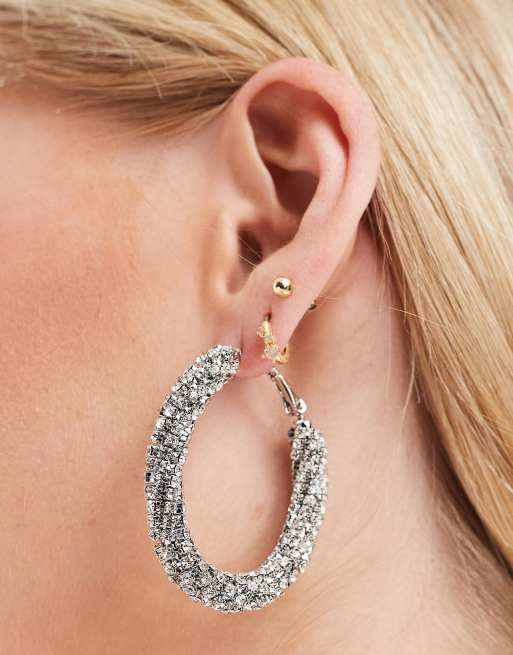 ASOS DESIGN oval hoop earrings in twist crystal drench