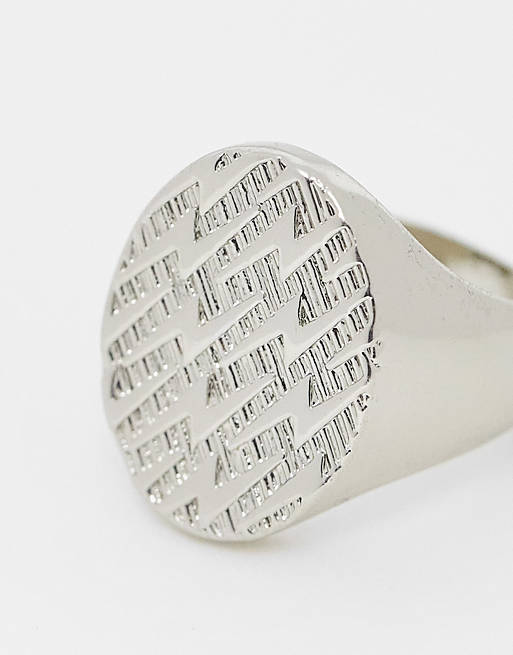 ASOS DESIGN oval signet ring with lightning bolt emboss in silver tone