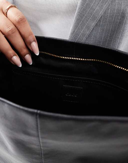 ASOS DESIGN Oversize Clutch aus schwarzem Leder