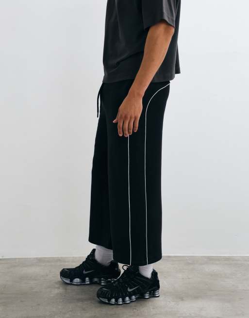 ASOS DESIGN Oversize-Jeansshorts in langer Länge mit Paspelierung in Schwarz, 2 von 5
