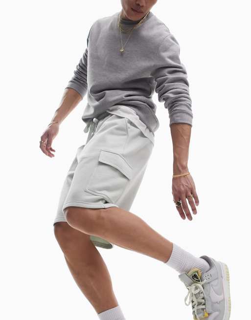 ASOS DESIGN – Oversize-Jerseyshorts mit Cargotasche in verwaschenem Grün