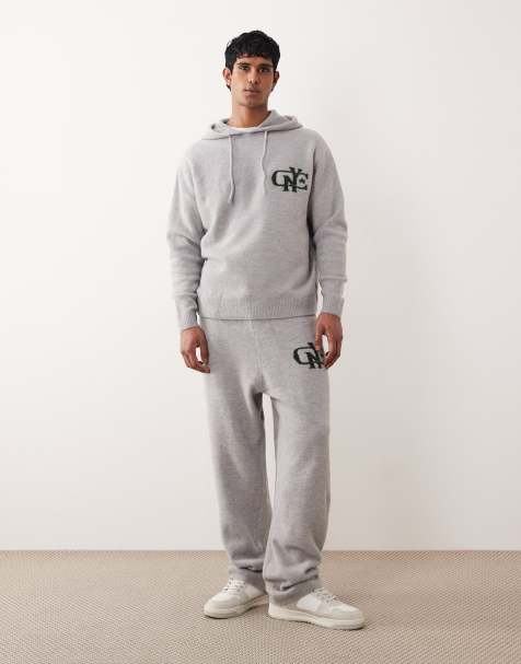 ASOS DESIGN – Oversize-Jogginghose aus Strickmaterial in verwaschenem Grau mit Bündchen und NYC-Logo auf der Brust, Kombiteil - view 1