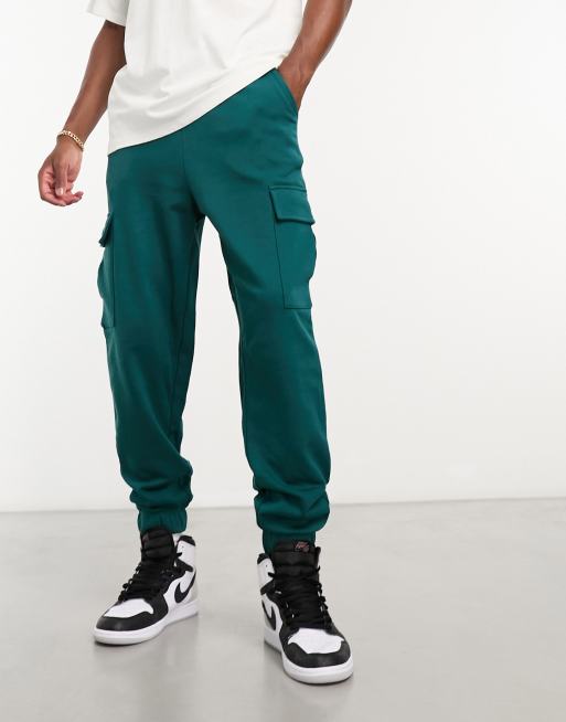 ASOS DESIGN – Oversize-Jogginghose in Blaugrün mit Cargotaschen