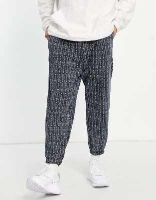 ASOS DESIGN – Oversize-Jogginghose in Schwarz mit durchgehendem Chicago-City-Print