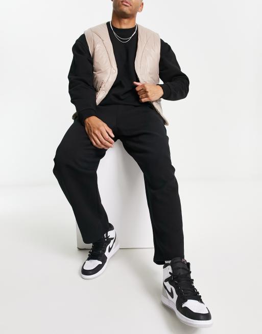 ASOS DESIGN – Oversize-Jogginghose in Schwarz mit weitem Bein und kurzem Schnitt