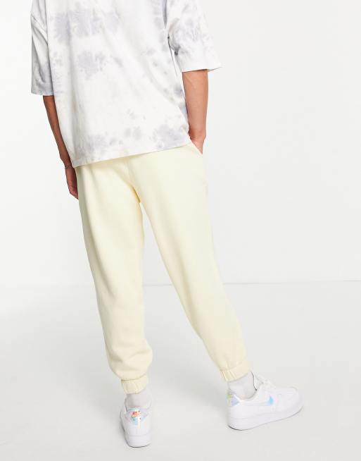 ASOS DESIGN – Oversize-Jogginghose mit Acid-Waschung in Gelb und kosmischem Print, Kombiteil, 2 von 4