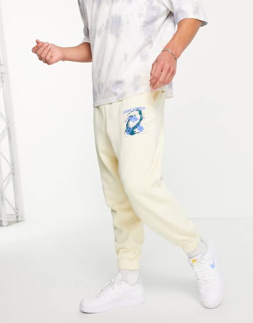 ASOS DESIGN – Oversize-Jogginghose mit Acid-Waschung in Gelb und kosmischem Print, Kombiteil, 4 von 4