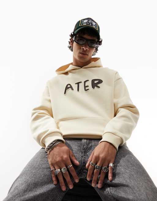 ASOS DESIGN – Oversize-Kapuzenpullover in Beige mit Textprint in ausgeschnittener Optik