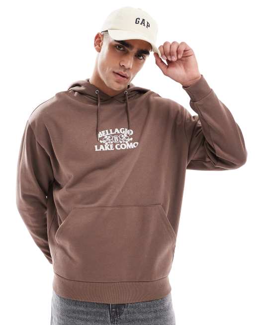 ASOS DESIGN – Oversize-Kapuzenpullover in Braun mit Print auf der Brust