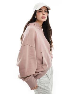 ASOS DESIGN - Oversize-Kapuzenpullover in gewaschenem Altrosa mit asymmetrischem Saum