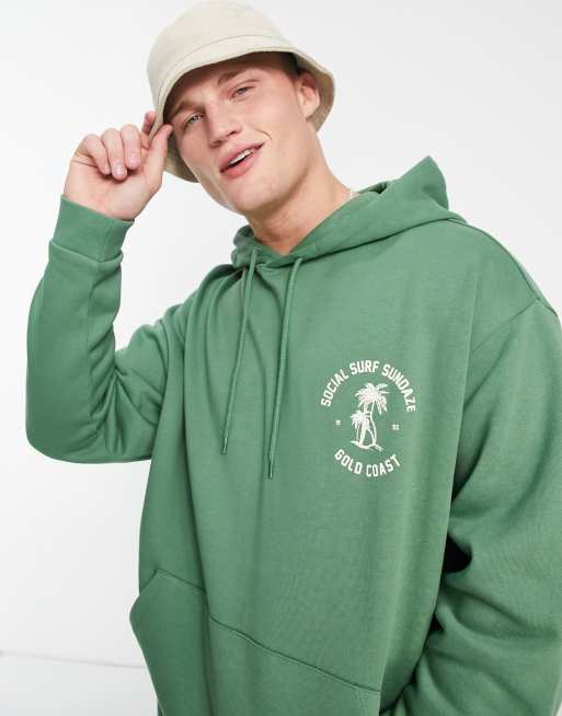 ASOS DESIGN Oversize Kapuzenpullover in Grun mit Surfing Logoprint Kombiteil ASOS