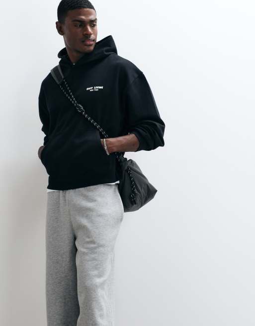ASOS DESIGN – Oversize-Kapuzenpullover in Schwarz mit Print, 4 von 5