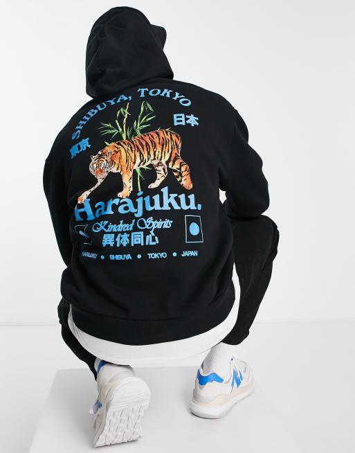 ASOS DESIGN – Oversize-Kapuzenpullover in Schwarz mit Tiger-Motiv auf der Rückseite