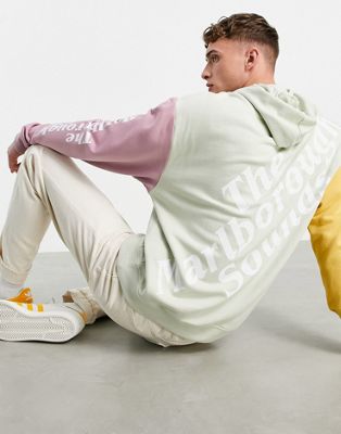 ASOS DESIGN – Oversize-Kapuzenpullover mit Blockfarbendesign und bunten platzierten Prints-Mehrfarbig