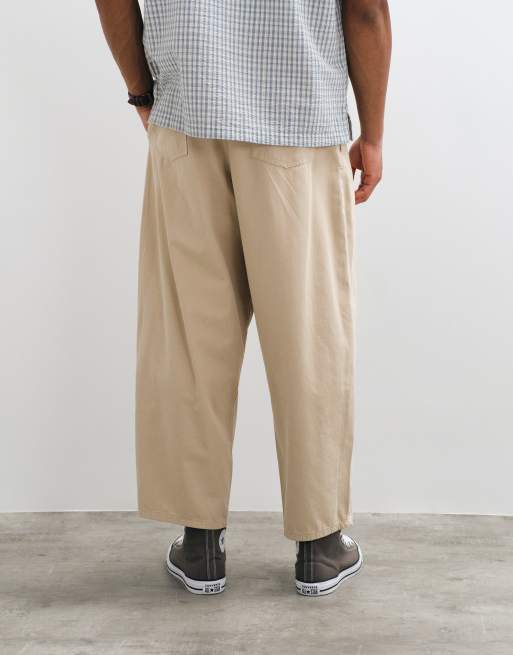 ASOS DESIGN Oversize konisch zulaufende Hose in Beige mit Bundfalten, 2 von 5