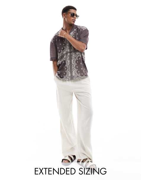 ASOS DESIGN – Oversize-Polohemd mit durchgehendem Paisley-Print und Reverskragen - view 1