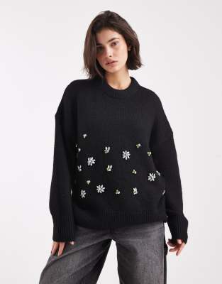 ASOS DESIGN - Oversize-Pullover in Schwarz mit Blumenverzierung