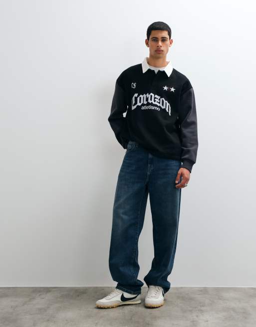 ASOS DESIGN Oversize-Rugbyshirt mit verdeckter Knopfleiste und Pigmentdruck in Schwarz, 2 von 5
