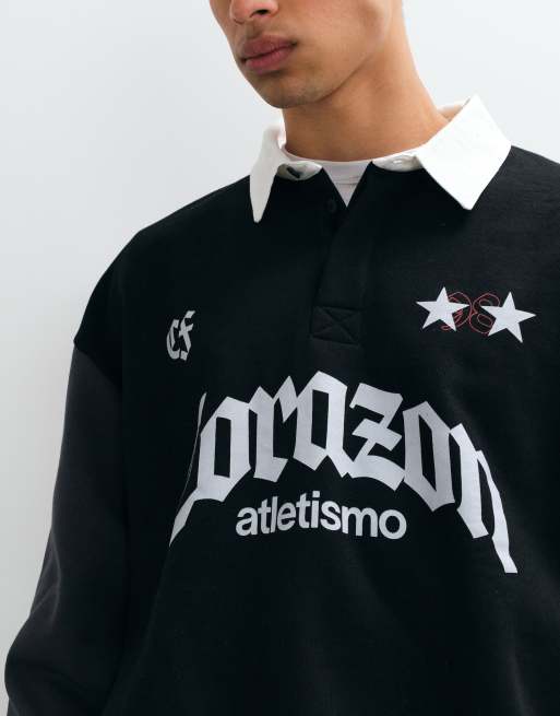 ASOS DESIGN Oversize-Rugbyshirt mit verdeckter Knopfleiste und Pigmentdruck in Schwarz, 4 von 5