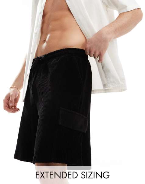 ASOS DESIGN – Oversize-Shorts aus geripptem Velours in Schwarz mit Cargo-Taschen - view 1