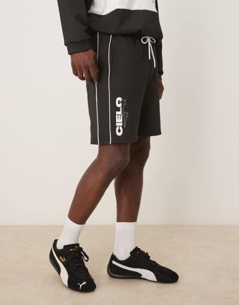 ASOS DESIGN – Oversize-Shorts aus neoprenartigem Material in Schwarz mit Print, Kombiteil - view 1