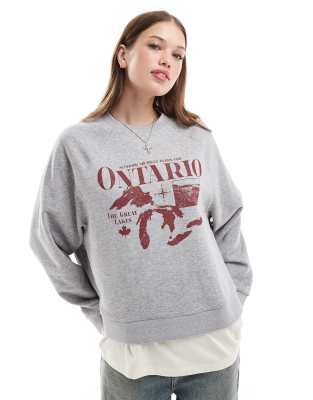 ASOS DESIGN - Oversize-Sweatshirt in Grau meliert mit „Ontario"-Grafik und Raglanärmeln