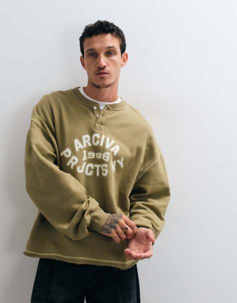 ASOS DESIGN oversize sweatshirt med knappslå och tryck i khaki - view 1