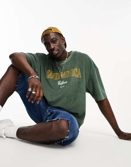 ASOS DESIGN – Oversize-T-Shirt aus Frottee in Grün mit City-Print
