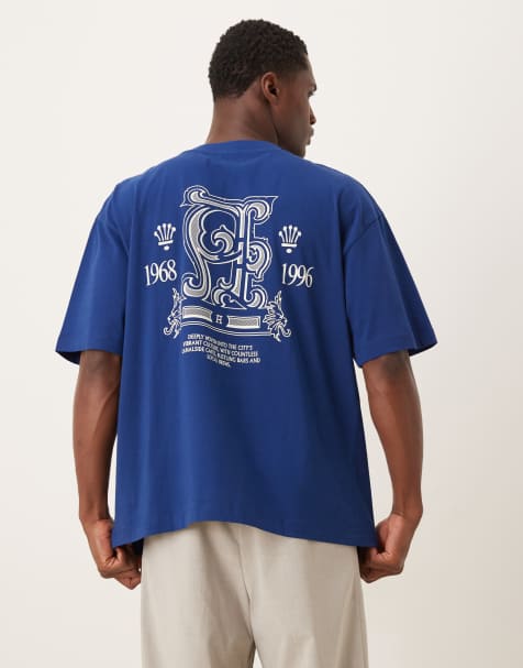 ASOS DESIGN – Oversize-T-Shirt in Blau mit Text- und Wappen-Grafikprint - view 1