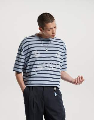 ASOS DESIGN – Oversize-T-Shirt in Blau und Schwarz gestreift mit Print vorne - view 1