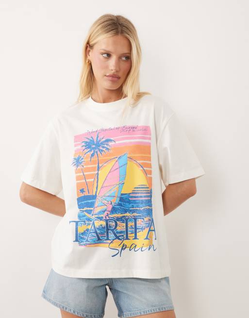 ASOS DESIGN – Oversize-T-Shirt in Cremeweiß mit „Tarifa“-Urlaubsmotiv im Vintage-Look, 1 von 4