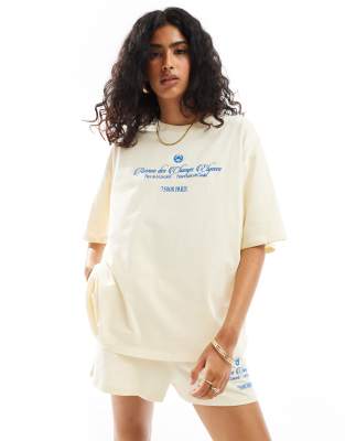 ASOS DESIGN - Oversize-T-Shirt in Gelb mit „Champs Elysees"-Stickerei, Kombiteil