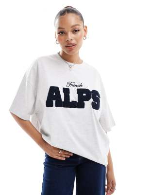 ASOS DESIGN - Oversize-T-Shirt in Kalkgrau mit „Alps"-Logoprint