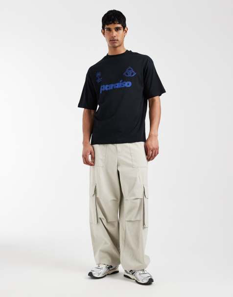 ASOS DESIGN – Oversize-T-Shirt in Schwarz mit Fußball-Grafik - view 1