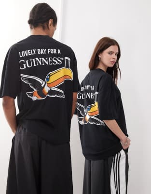 ASOS DESIGN - Oversize-T-Shirt in Schwarz mit Unisex-Schnitt und „Guinness"-Prints