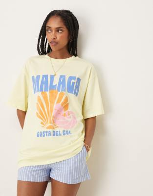 ASOS DESIGN - Oversize-T-Shirt in Zitronengelb mit „Malaga"-Muschel-Grafikprint