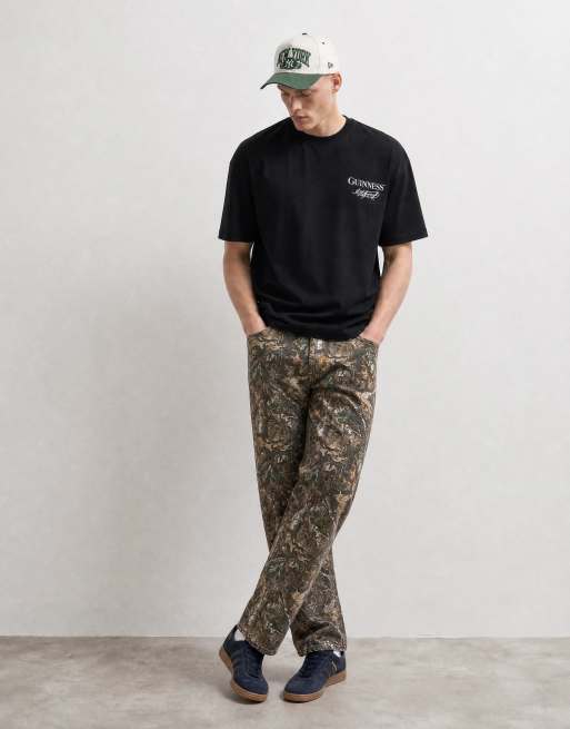 ASOS DESIGN oversize t-shirt med Guinness-tryck på ryggen i svart, 10 av 10