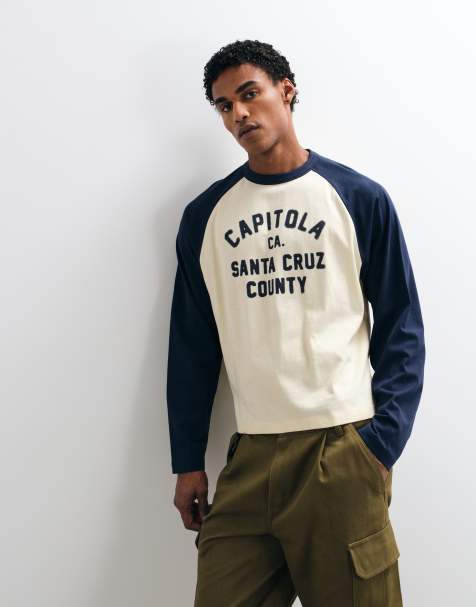 ASOS DESIGN oversize T-shirt z długim rękawem raglanowym, nadrukiem tekstowym i zaokrąglonym dołem w kolorze kremowym i granatowym - view 1