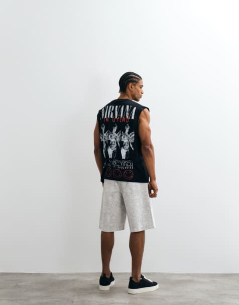 ASOS DESIGN – Oversize-Tanktop mit Rundhalsausschnitt und „Nirvana“-Print in Schwarz - view 1