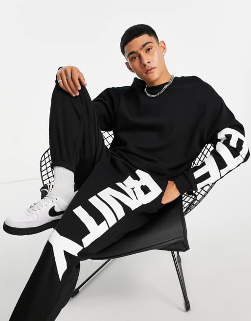 ASOS DESIGN – Oversize Trainingsanzug in Schwarz mit großem „Eternity“-Textprint - SCHWARZ