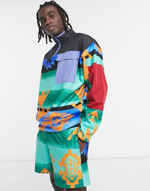 ASOS DESIGN – Oversize-Trainingsjacke aus Polarfleece mit Nylondetails und All-over-Print, Kombiteil