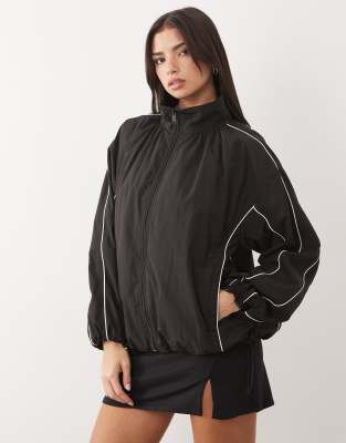ASOS DESIGN - Oversize-Trainingsjacke in Schwarz mit weißer Paspelierung und Ballonsaum-Bunt