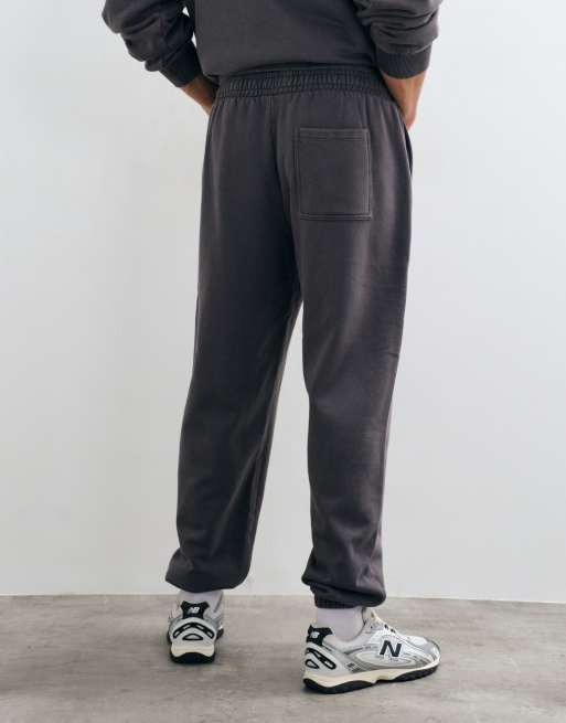 ASOS DESIGN oversized acid wash cuffed sweatpants in charcoal, 3 of 5