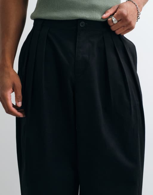 ASOS DESIGN oversized avsmalnande byxor i svart med tredubbla veck, 5 av 5